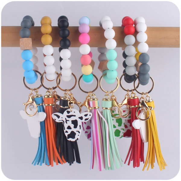 oly-17023b297b79d594936018590672dae9 Wholesale Western Style Bull Head Keychain Bracelet Silicone Bead with Tassel Fashion Accessory