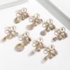 oly-185318fb32eeb4a9106e4bb95e18f410 Wholesale Resin Gold Plated Shell Keychain Pendant for Bag Car Decoration Boutique Resale