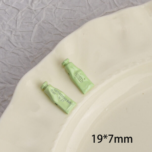 oly-1b76dacc082f1c2befcbd2e663ee677b Wholesale Alloy Painted Toothpaste Charm DIY Phone Strap Accessory for Resale