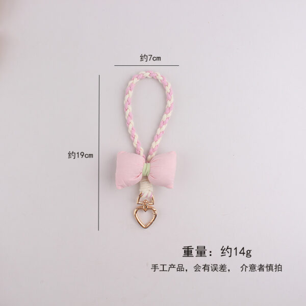 oly-21647902e7a826c2f4048890d03d86ec Wholesale Silicone Dopamine Bow Phone Strap Heart Keychain Fashion Accessory Yellow