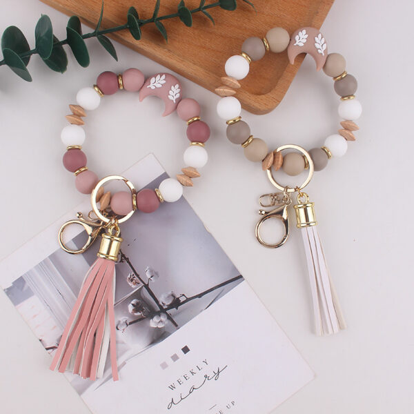 oly-23ddc1bbb4a9b5ec34cf23208082bd1e Wholesale Silicone Moon Bead Tassel Keychain Korean Style Fashion Accessory Gift