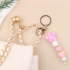 oly-2587ef67e7906e0462b820ae9f65eb93 Wholesale Pink Silicone Bead Bracelet Cartoon Flower Keychain DIY Pendant Fashion Accessory Gift