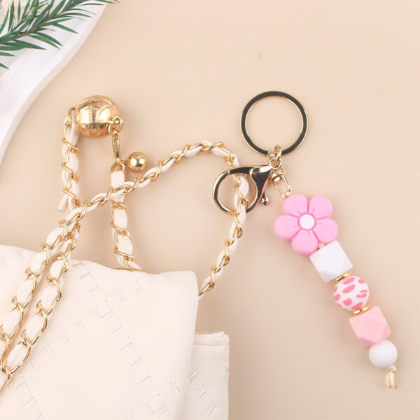 oly-2587ef67e7906e0462b820ae9f65eb93 Wholesale Pink Silicone Bead Bracelet Cartoon Flower Keychain DIY Pendant Fashion Accessory Gift