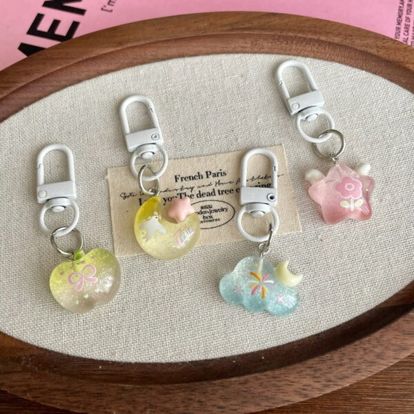 oly-25e3e72490cf0dd91a3a0ebebc7260ca Wholesale Resin Star Cloud Bag Charm Cute Keychain for Girls Trendy School Backpack Accessory