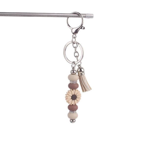 oly-2d7d0a537abf7a80c78e684c0063899c Wholesale Silicone Keychain - Stylish Bag Charm with Tassel, Pink, Party Favor Gift