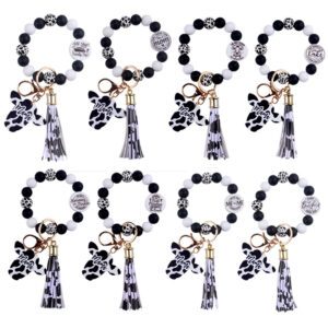 oly-326e34ed4500553bfe0d133c1d03c7e7 Wholesale Silicone Cartoon Cow Head Keychain with Bead Bracelet and Tassel Korean Style Decorative Accessory