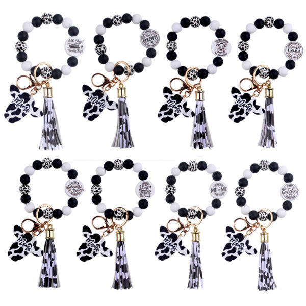 oly-326e34ed4500553bfe0d133c1d03c7e7 Wholesale Silicone Cartoon Cow Head Keychain with Bead Bracelet and Tassel Korean Style Decorative Accessory