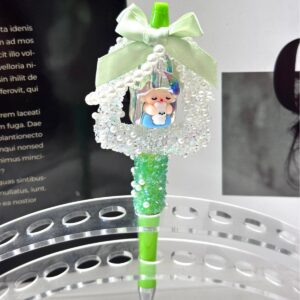 A green finished pen