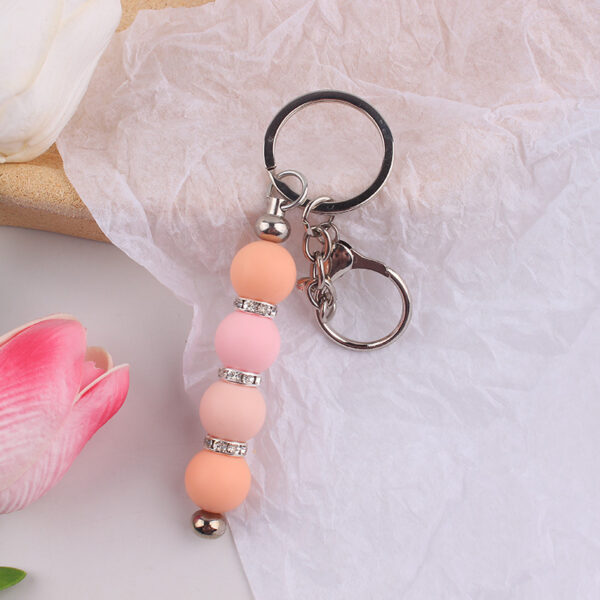 oly-342d82e710a73423542344833b649239 Wholesale DIY Silicone Bead Keychain Maple Leaf Red Bag Charm Gift