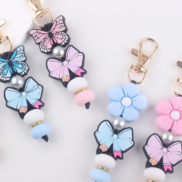 oly-3696493f402bad0bd65dc4817a2df07b Wholesale Korean Style Silicone Butterfly Flower Keychain DIY Decorative Accessory Gift