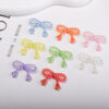 oly-3933cbf1742e8257f7a41ea44788970c Wholesale Colorful Bow Design Acrylic Loose Beads UV Coated for DIY Phone Chain Bag Charm Boutique Resale