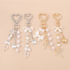 Wholesale Resin Golden Love Bow Heart Key Chain, Pearl Bow Keyring Trendy Boutique Resale Key Accessory