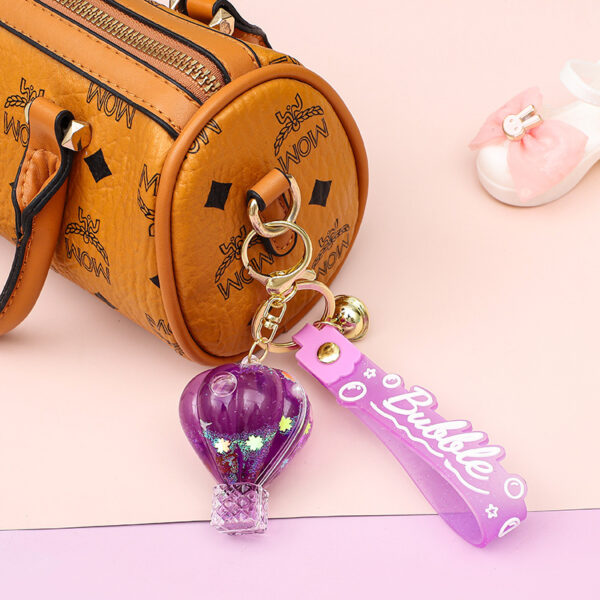 oly-3b251748d2746ad6db67936e1fe6f993 Wholesale Decorative Pink Hot Air Balloon Acrylic Keychain with Oil Filled Quicksand Bag Charm Gift