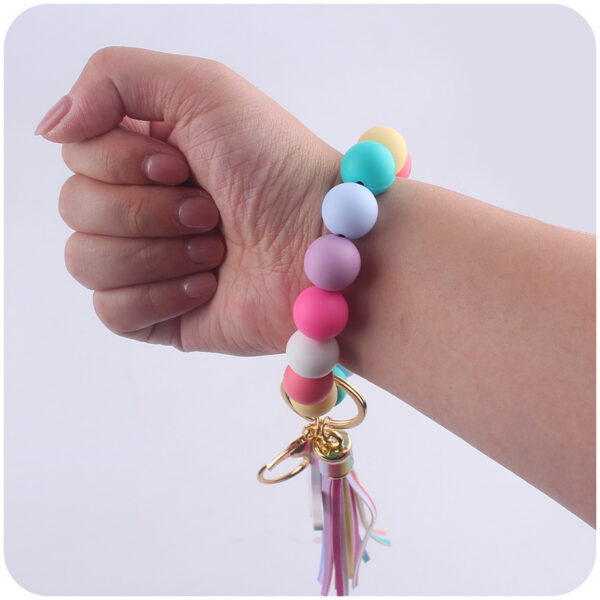 oly-3b57adc42aa194d746cd29c5fe0d6346 Wholesale Western Style Bull Head Keychain Bracelet Silicone Bead with Tassel Fashion Accessory