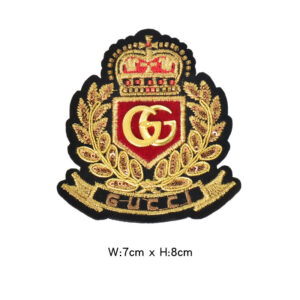 Gold and red letter badge