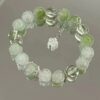 oly-46a0d593f07d44cc9423624a86a0c625 Wholesale Zinc Alloy Electroplated Green Floral Bracelet Fashion Accessory for Women
