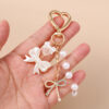 Wholesale Resin Golden Love Bow Heart Key Chain, Pearl Bow Keyring Trendy Boutique Resale Key Accessory
