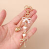 Wholesale Resin Golden Love Bow Heart Key Chain, Pearl Bow Keyring Trendy Boutique Resale Key Accessory
