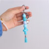 oly-5110f3c1e6aa7e5e5c1b609409ff776c Wholesale Silicone Cross Tassel Beaded Keychain Black White Car Key Accessory Boutique Resale