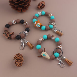 oly-51ae72391d00d340bb324cdec131e9e6 Wholesale Western Cowboy Silicone Beaded Bracelet Keychain Trendy Tassel Bag Charm for Party Gifts