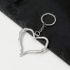 Wholesale Zinc Alloy Heart Keychain Pendant Irregular Hollow Design Bag Charm Fashion Accessory for Boutique Resale
