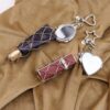 oly-53e8e9d22203b14a749bfcd4e6b85a5e Wholesale Silver Lipstick Bag Charm Keychain Trendy Metal Fashion Accessory for Gift and Boutique Resale