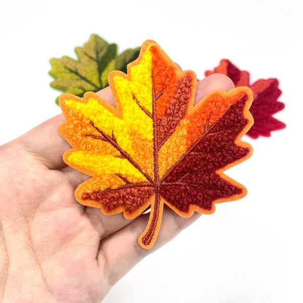 oly-53f279c207f6727d35a6ec1f97d3ea52 Wholesale Maple Leaf Chenille Embroidered Patch Iron On 7cm Fashion Accessory