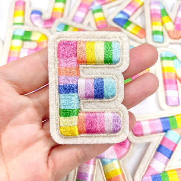 oly-55950cc3cc73024474fc040956e7dbd1 Wholesale Polyester Embroidered Letter Patches Rainbow Design Self-Adhesive for Shoes Hats