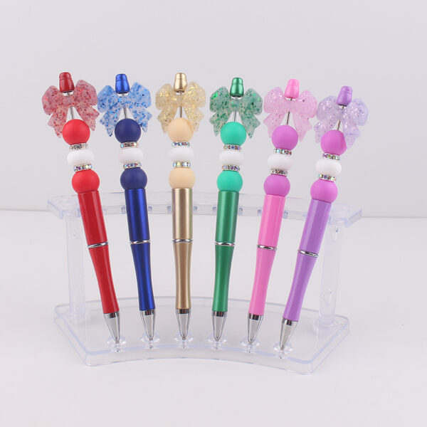 oly-5647e3f3defffa2e4167258ce4902c11 Wholesale Chic Silicone Bow Rotating Ballpoint Pen Trendy Office & Everyday Writing Accessory
