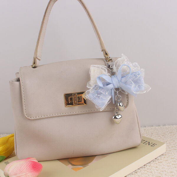 oly-5656d04fa508d13ea0e69bca779df3cb Wholesale Lolita Style Pink Silicone Bag Charm with Heart Lace Bow Fashion Accessory Keychain