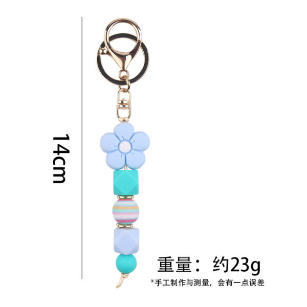 oly-573ad4b82e05226474ce2a234f27fb7e Wholesale Pink Silicone Bead Bracelet Cartoon Flower Keychain DIY Pendant Fashion Accessory Gift