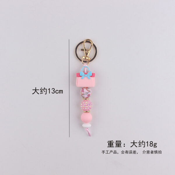 oly-57f2c4332e659654c1aa987148d42284 Wholesale Fashion Silicone Perfume Bottle Keychain Resale Gift Accessory