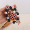 oly-58219cb22e896a4b80b5d18f729c3e60 Wholesale Plaid Wood Bead Tassel Silicone Keychain Fashion Accessory Boutique Resale Gift