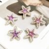 oly-58630f67f97f6310a95e7fdac5f8f7cf Wholesale Electroplated Pink Alloy Pentagram Starfish Loose Beads for DIY Bag Charm