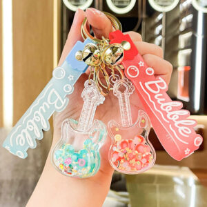 oly-5b6bd56734349dfb08cb2f39d747cdf5 Wholesale Luminous Guitar Keychain Acrylic Oil Filled Bag Charm Gift