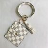 oly-5c2cdbfded559e3d5f658b3ef4949119 Wholesale PU Leather Plaid Tassel Keychain with Wooden Beads Chic Car Key Accessory for Women