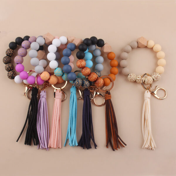 oly-5e268f10afa094c5acd501e655a05222 Wholesale European Style Silicone Bead DIY Bracelet Keychain with Leather Tassel Fashion Jewelry Accessory Gift