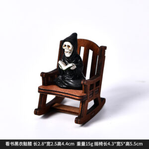 Dy2265c reading black skull + rocking chair halloween ornament
