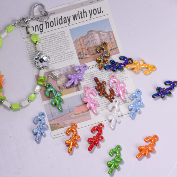 oly-667a47355821a98b454ced8663459dfe Wholesale UV Plated Acrylic Christmas Cane Pendant DIY Phone Charm Resale Jewelry Accessory