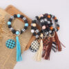 oly-673dc12997c58d9d1d14b11a1176aa8e Wholesale Plaid Wood Bead Tassel Silicone Keychain Fashion Accessory Boutique Resale Gift
