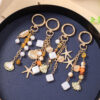 oly-6bb950fe083915d327479ccd39912b1c Wholesale Sea Star Pearl Keychain Zinc Alloy Bag Charm Decorative Car Key Accessory