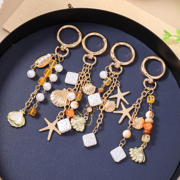oly-6bb950fe083915d327479ccd39912b1c Wholesale Sea Star Pearl Keychain Zinc Alloy Bag Charm Decorative Car Key Accessory