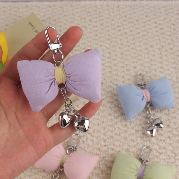 oly-6e61177b3b08493b9b30f82fef47cc1e Wholesale Silicone Bow Keychain Fashion Accessory Pendant for Bags and Phones