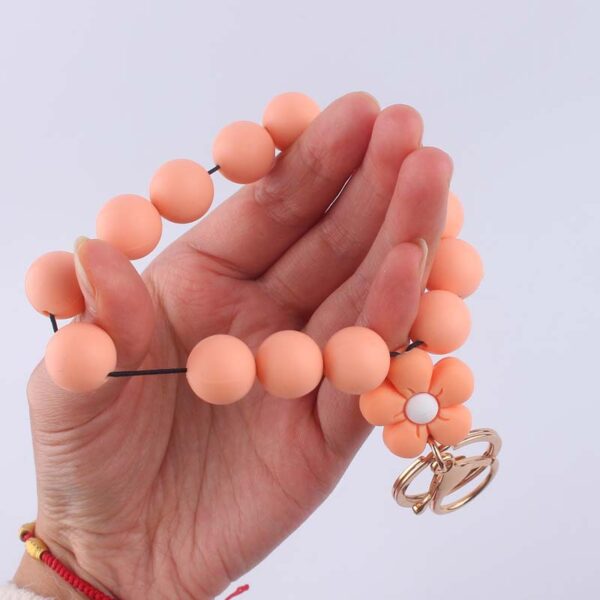 oly-6fcf3ae66e64be4432293717b32fd460 Wholesale Pink Silicone Cartoon Flower Beaded Wristband Keychain Boutique Jewelry Accessory