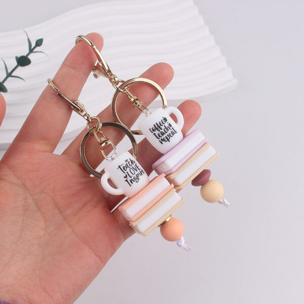 oly-70a9f14f247e7905772a8250f189554f Wholesale Trendy Book Silicone Keychain Handmade Beaded Purple Heart Charm Resale Gift