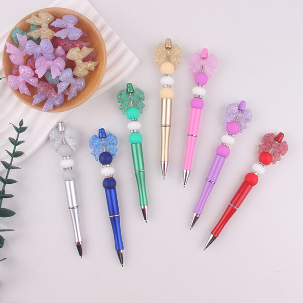 oly-73ccaeb211b583f8ea06f4bf8d3e334a Wholesale Chic Silicone Bow Rotating Ballpoint Pen Trendy Office & Everyday Writing Accessory