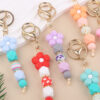 oly-790795bc9a5a75389dca197eac8ec546 Wholesale Pink Silicone Bead Bracelet Cartoon Flower Keychain DIY Pendant Fashion Accessory Gift