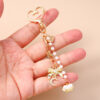 oly-7a14b56a0284d0bedd130bb68a6a55b6 Wholesale Modern Minimalist Bow Bead Keychain, Zinc Alloy Star Heart Design, Casual Bag Charm Accessory