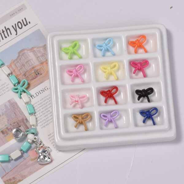 oly-7a6a75462e2c828a428bcebfa6ad597f Wholesale Small Bow Acrylic Loose Beads Mixed Color DIY Phone Chain Jewelry Making Fashion Accessory Gift Boutique Resale