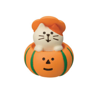 White cat in pumpkin pot